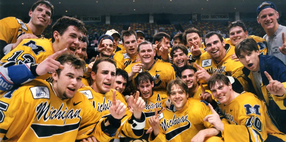 bhl-um-ice-hockey-team-celebrating-with-1996-7-ncaa-playoff-trophy