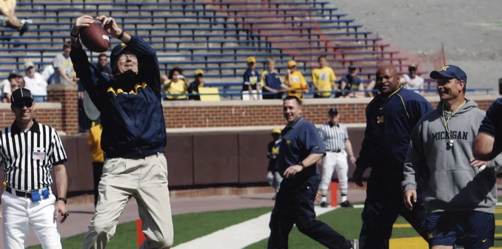 bhl-lloyd-carr-u-m-football-catching-ball