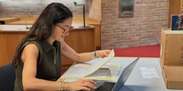 bhl-charlotte-brivio-looking-at-papers